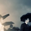 Specialised insurance - man with colourful protective umbrella
