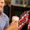 Customers enjoying a beer in a well-insured pub, public house, bar or inn
